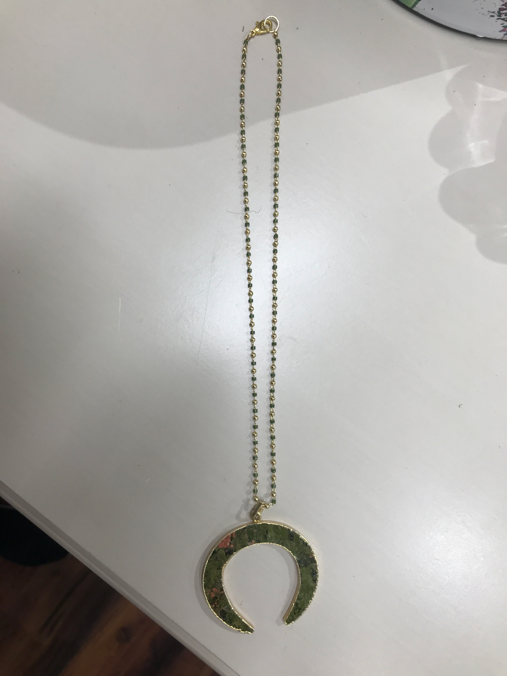 Green horn necklace